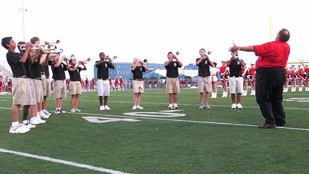 Mr.+Reed+led+the+Trumpet+Choir+in+playing+the+National+Anthem+before+a+Varsity+football+game.+photo+courtesy+of+Mr.+Todd+Toney