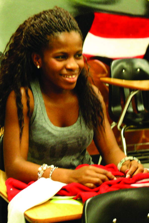 Sitting in her Mentors’ class, Blessing Orji laughs with her fellow classmates. 