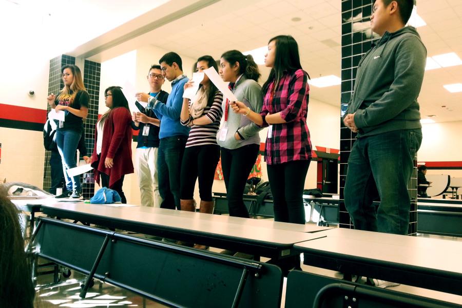 The Key Club officers stand ready to give out details of the schedule.